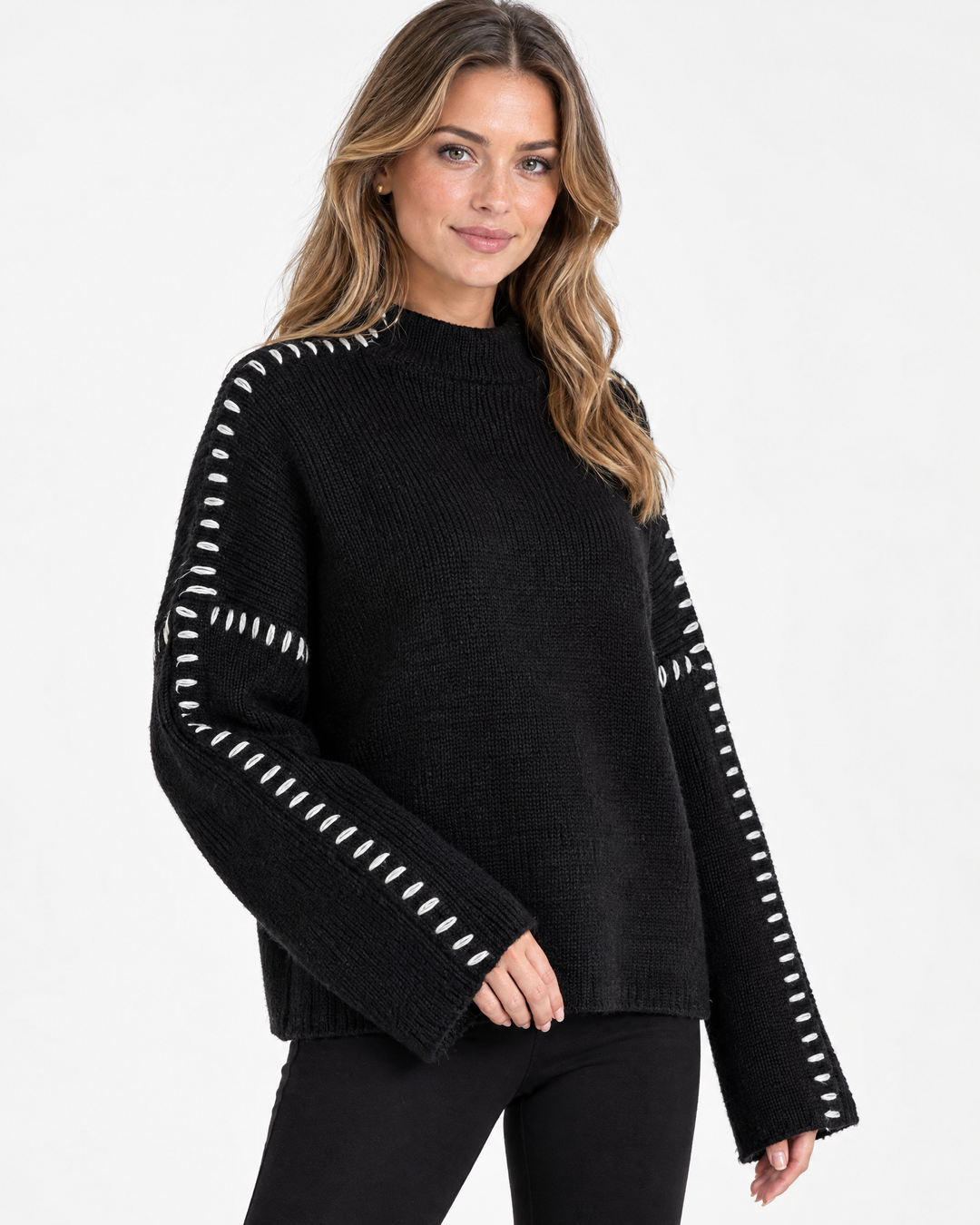Aurev London Dionne sweater in Black worn by model - angle view