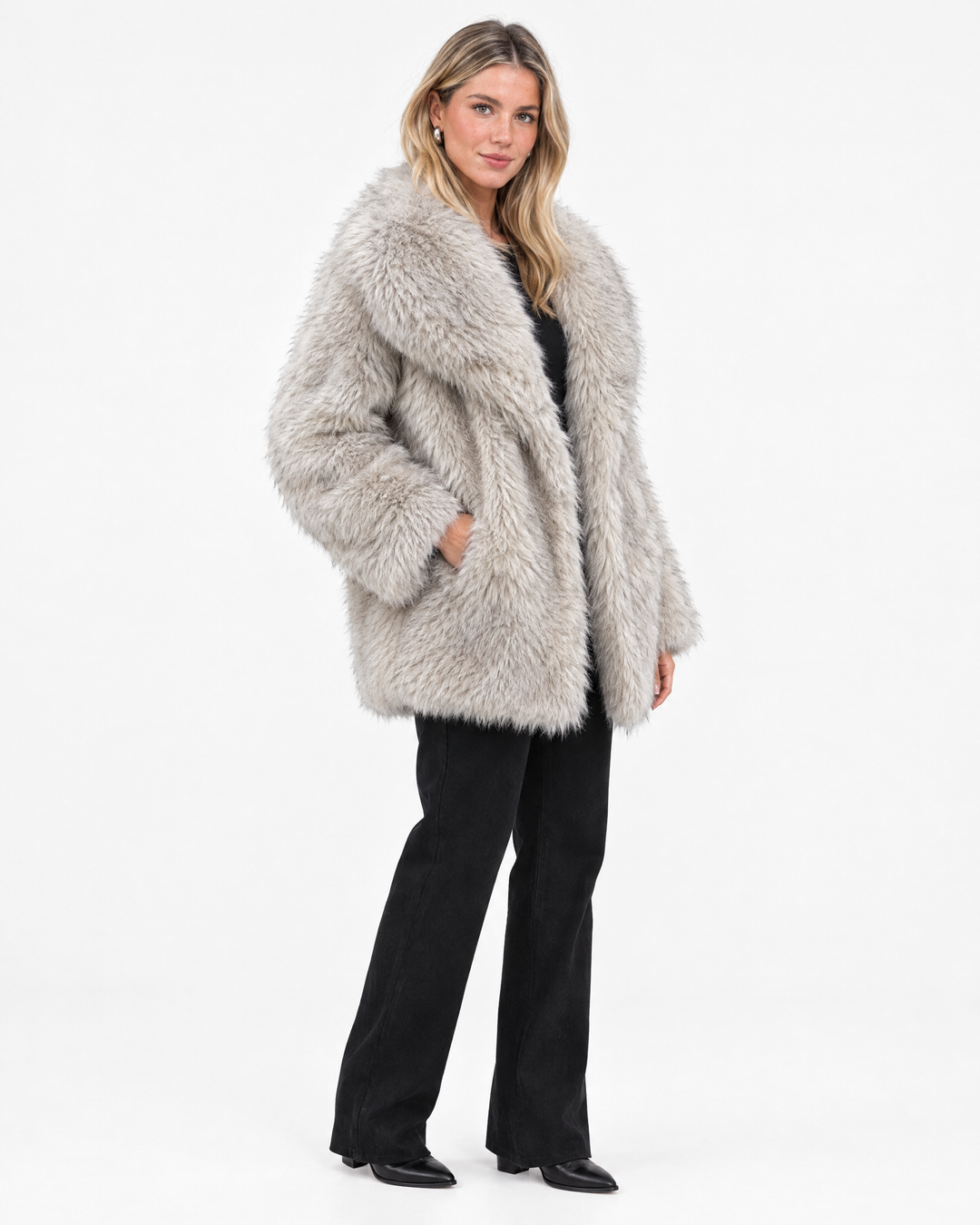 Aurev London Esther coat in Beige worn by model - angle view