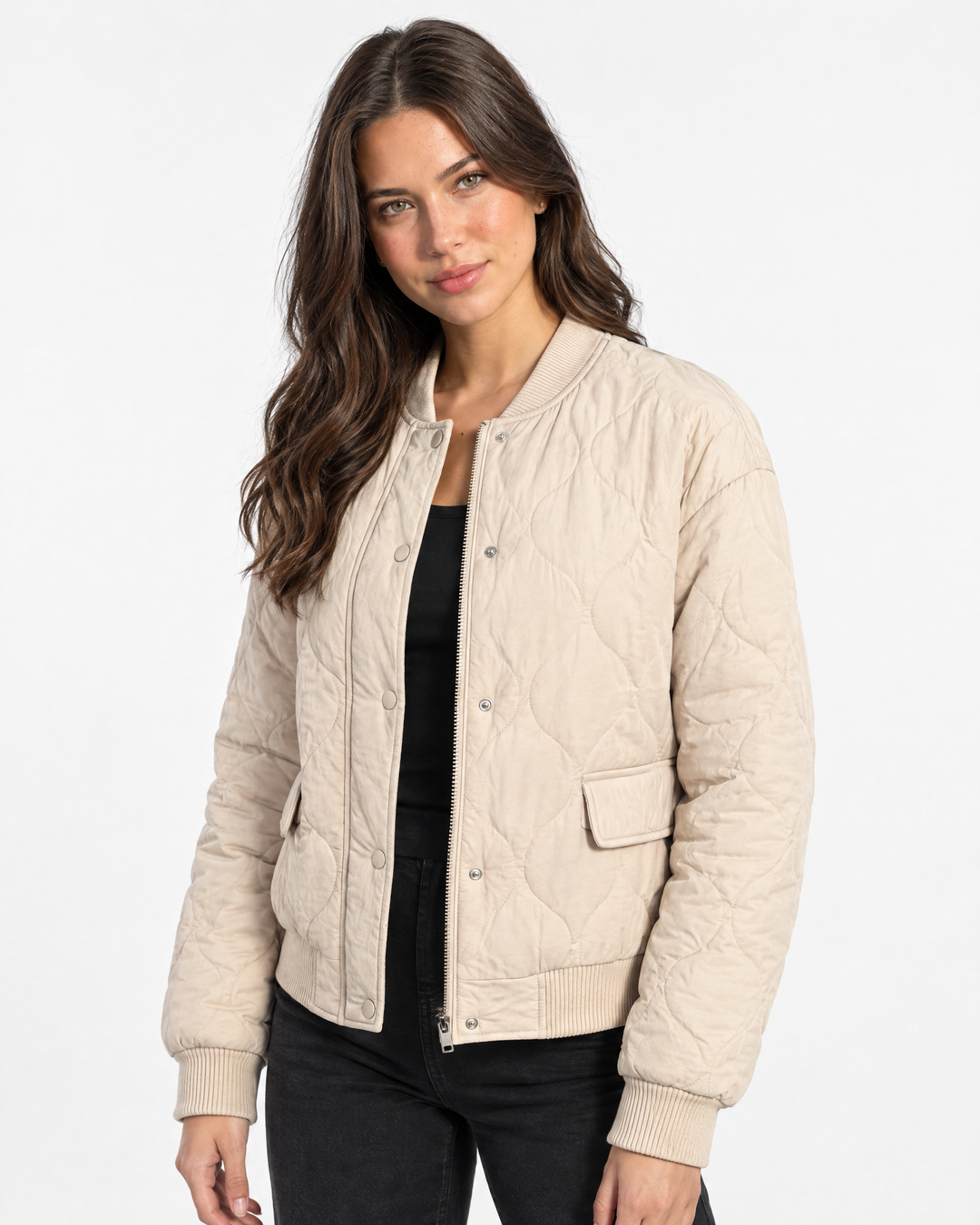 Aurev London Bronwen Polished Quilted Bomber Jacket in Beige - model angle shot showing thickness and hem
